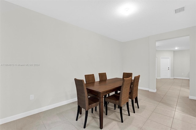 dining area with light tile patterned floors