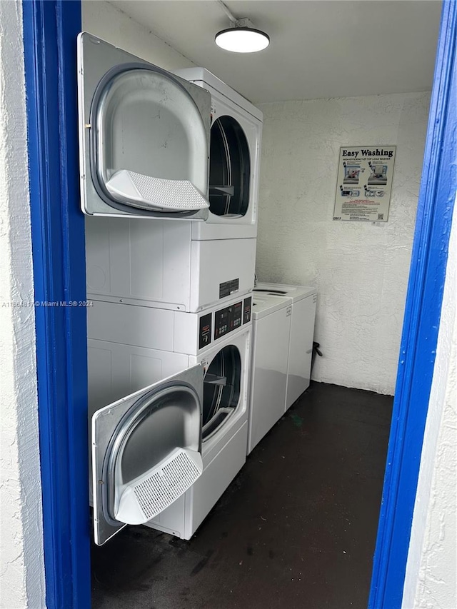 laundry room featuring independent washer and dryer and stacked washer / drying machine