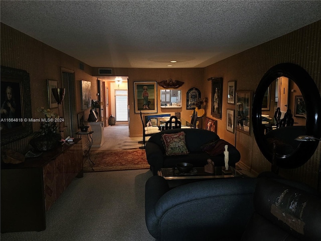 carpeted living room with a textured ceiling