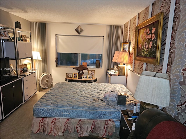 carpeted bedroom with a textured ceiling