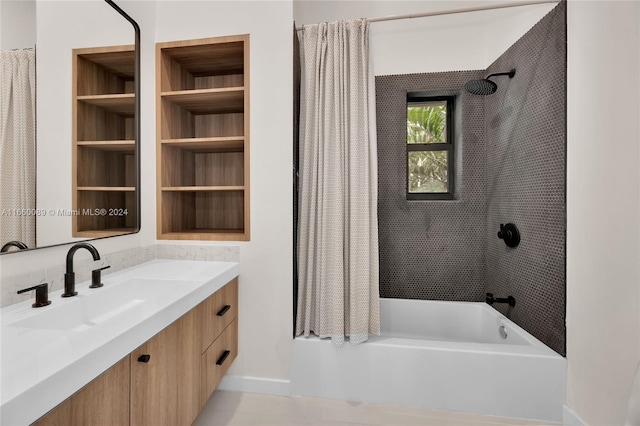 bathroom featuring tile patterned flooring, shower / bath combo, and vanity