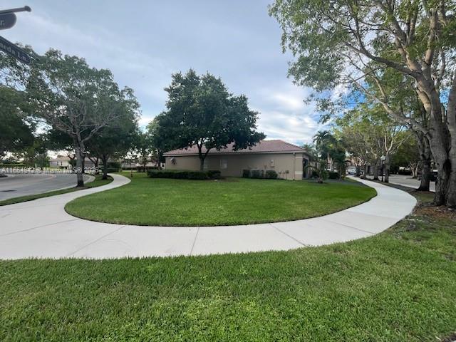 view of community featuring a yard