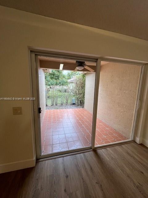 doorway featuring wood-type flooring