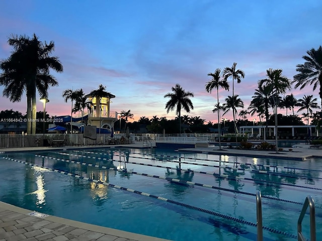 view of pool at dusk