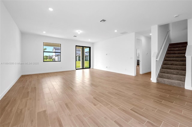 spare room featuring light hardwood / wood-style floors