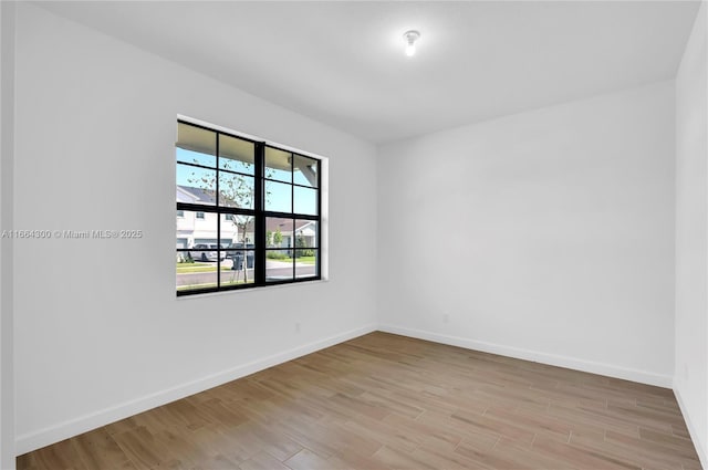 spare room with light hardwood / wood-style floors