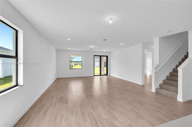 spare room with light hardwood / wood-style floors