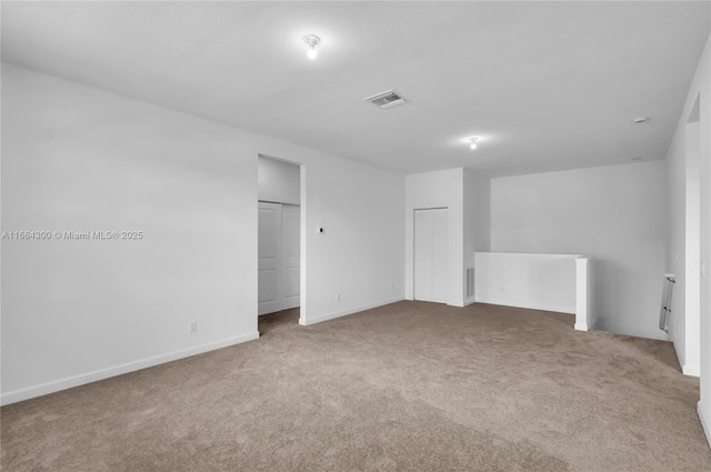 unfurnished room featuring carpet flooring