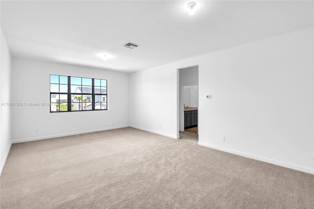 empty room featuring carpet floors