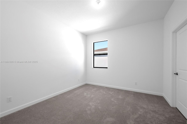 empty room with carpet flooring