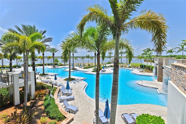 view of pool featuring pool water feature and a patio area