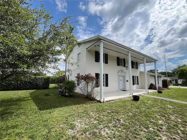 8901 SW 88th St, Miami, FL 33176 - neoclassical home with a patio, stucco siding, and a front lawn