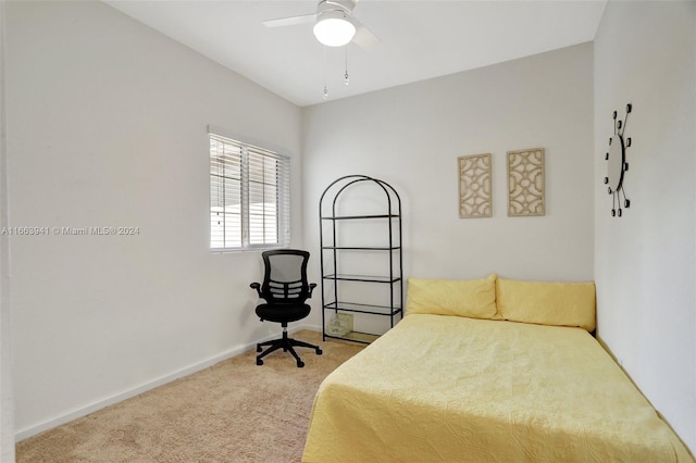 bedroom featuring ceiling fan and carpet