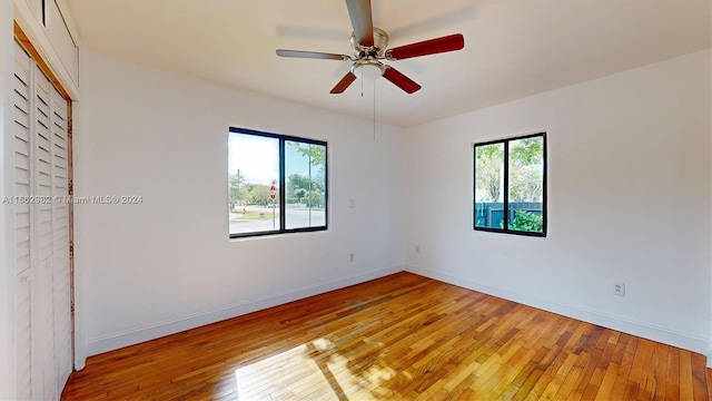 unfurnished room featuring light hardwood / wood-style floors and ceiling fan