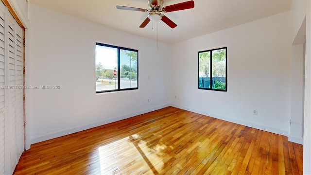 spare room with ceiling fan and hardwood / wood-style floors