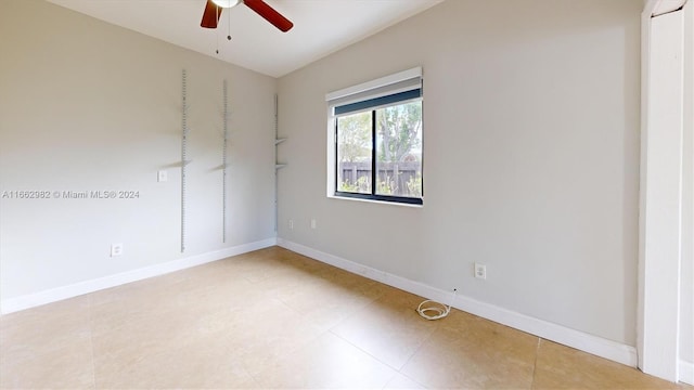 unfurnished room with ceiling fan