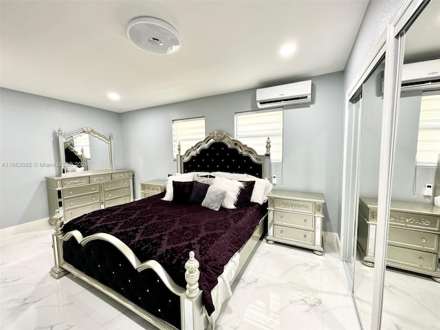 bedroom featuring a closet and a wall unit AC