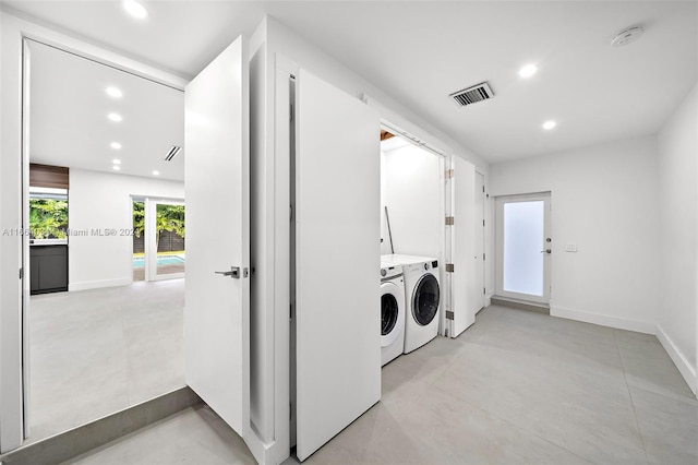 laundry room featuring washer and clothes dryer