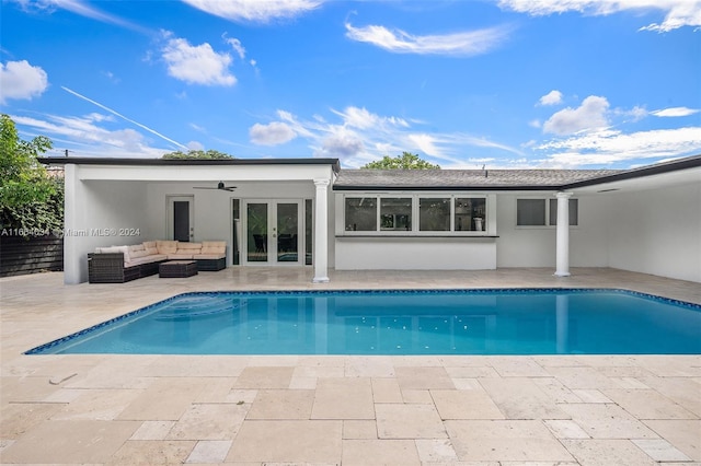 view of swimming pool featuring a patio, outdoor lounge area, ceiling fan, and french doors