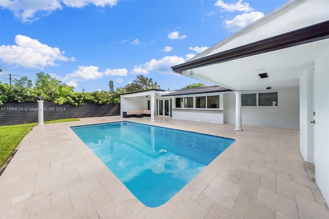 view of swimming pool featuring a patio area