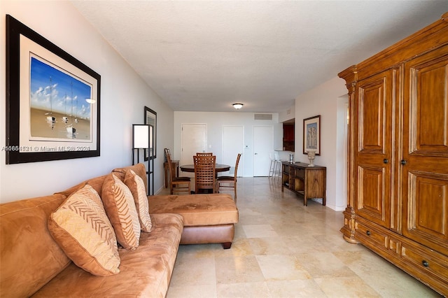 living room with a textured ceiling