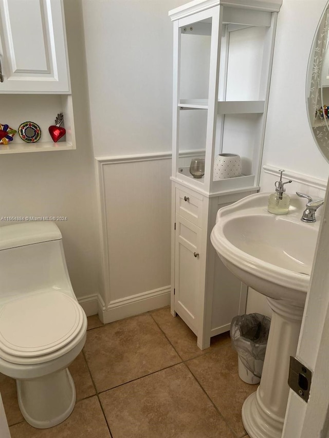 bathroom featuring tile patterned flooring and toilet