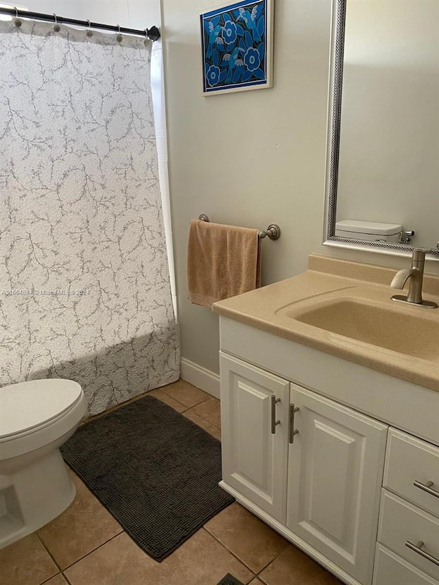 full bathroom with shower / bath combination with curtain, vanity, toilet, and tile patterned floors