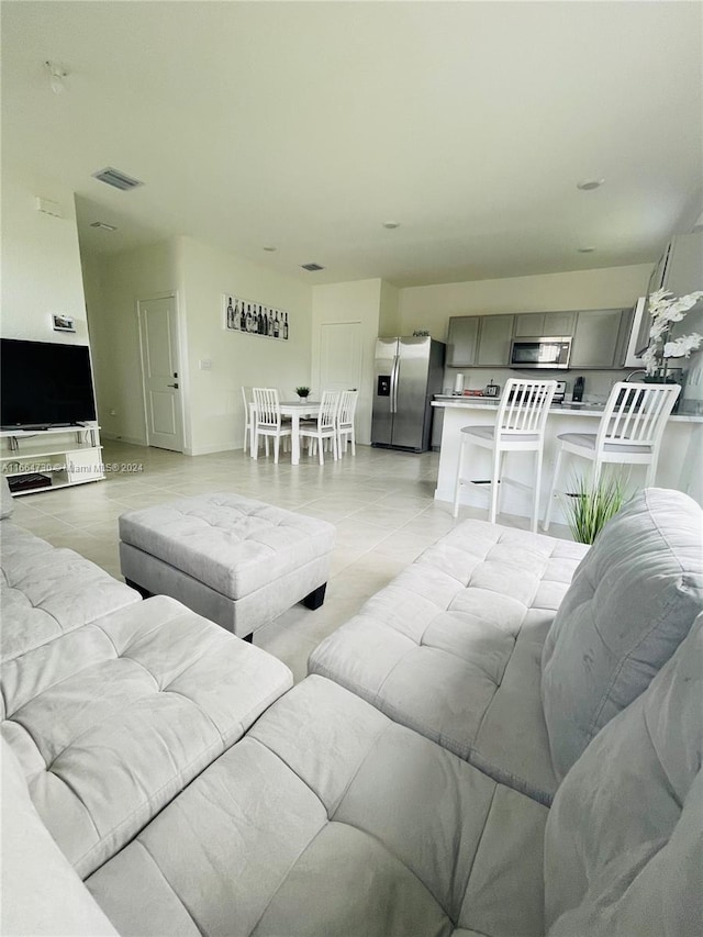 living room featuring light tile patterned floors