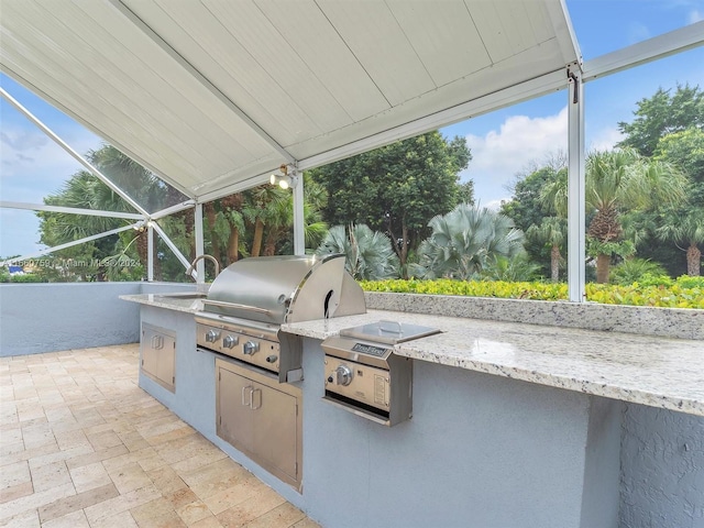 view of patio / terrace with area for grilling and a grill