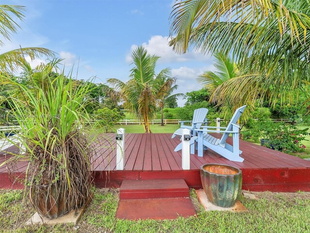 wooden terrace featuring a fire pit