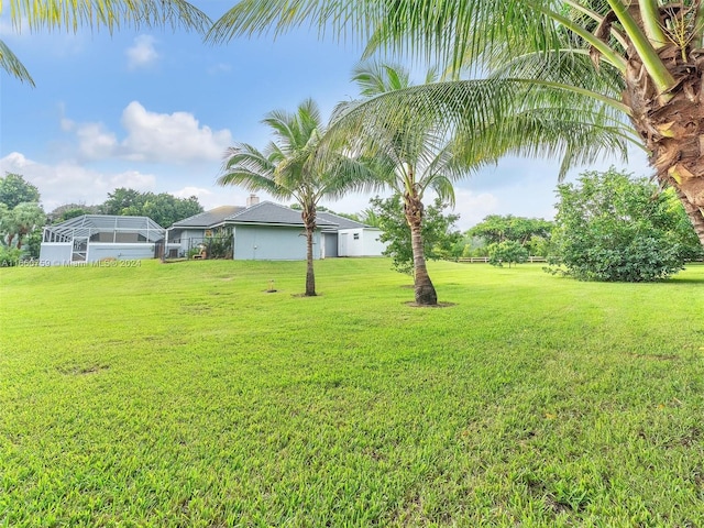 view of yard with a lanai