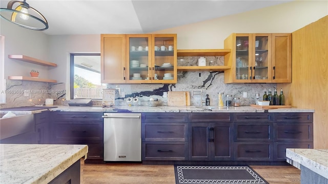 kitchen featuring backsplash, lofted ceiling, and dark hardwood / wood-style flooring