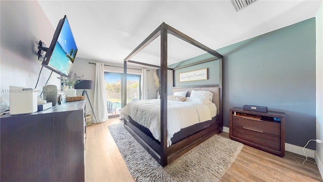 bedroom featuring light hardwood / wood-style floors