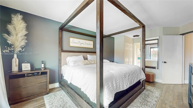 bedroom featuring a closet and hardwood / wood-style flooring