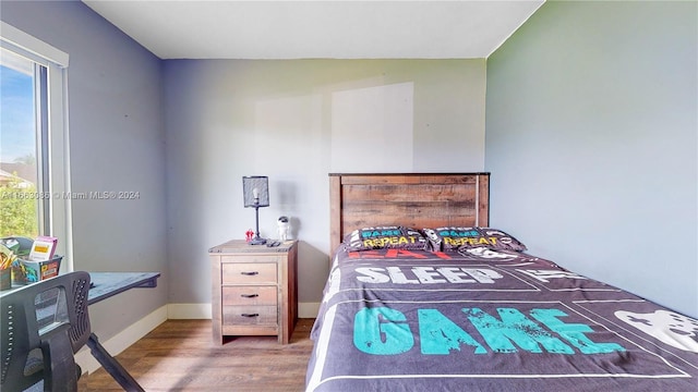 bedroom with wood-type flooring