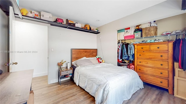 bedroom featuring a closet and hardwood / wood-style flooring