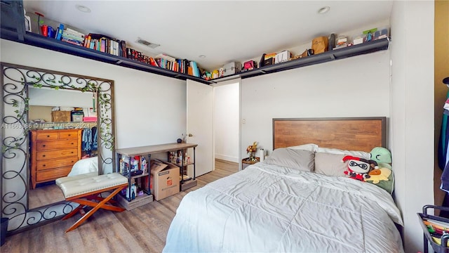 bedroom with hardwood / wood-style flooring