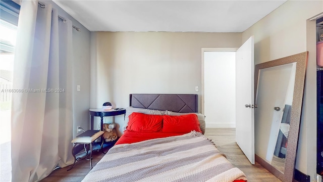 bedroom with wood-type flooring