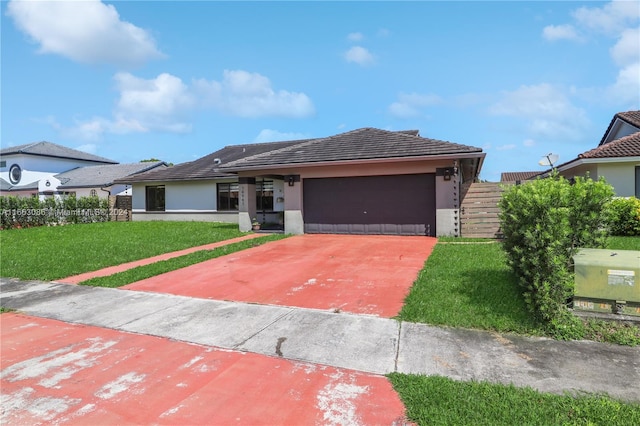 view of front of home featuring a garage and a front yard