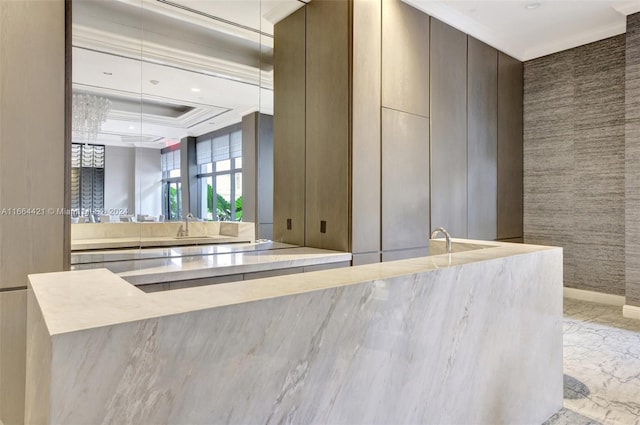 kitchen featuring sink and ornamental molding