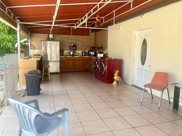 view of patio with washer and clothes dryer