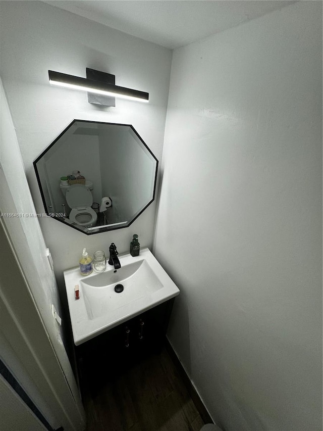 bathroom featuring vanity and hardwood / wood-style floors