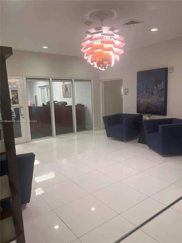 interior space featuring light tile patterned floors and a chandelier