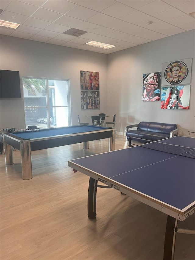 recreation room featuring wood-type flooring, pool table, and a paneled ceiling