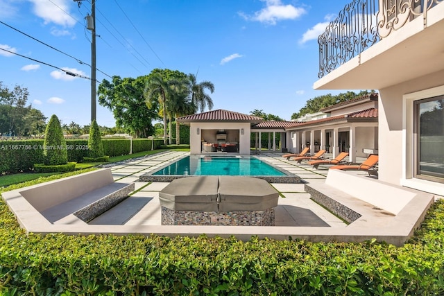 view of swimming pool with a fenced in pool, outdoor lounge area, and a patio