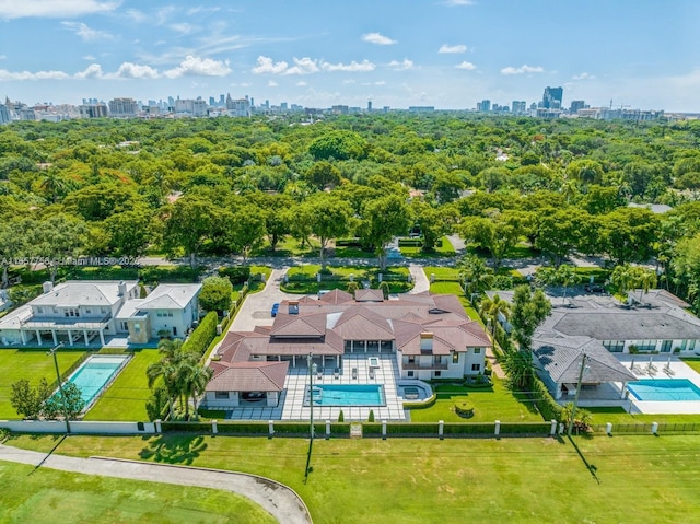 birds eye view of property with a view of city