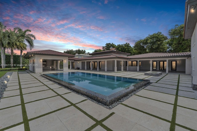 outdoor pool with a patio area