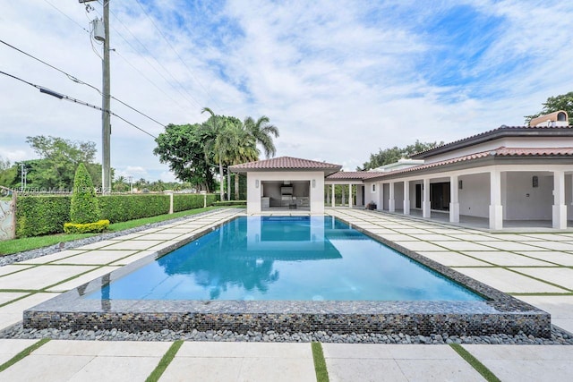 outdoor pool featuring a patio