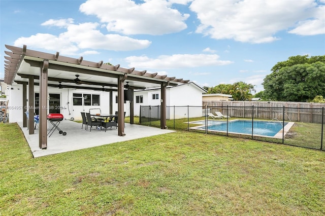 view of yard with a pergola, a fenced in pool, ceiling fan, and a patio