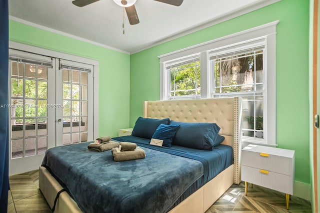 bedroom with radiator, ceiling fan, french doors, parquet floors, and ornamental molding